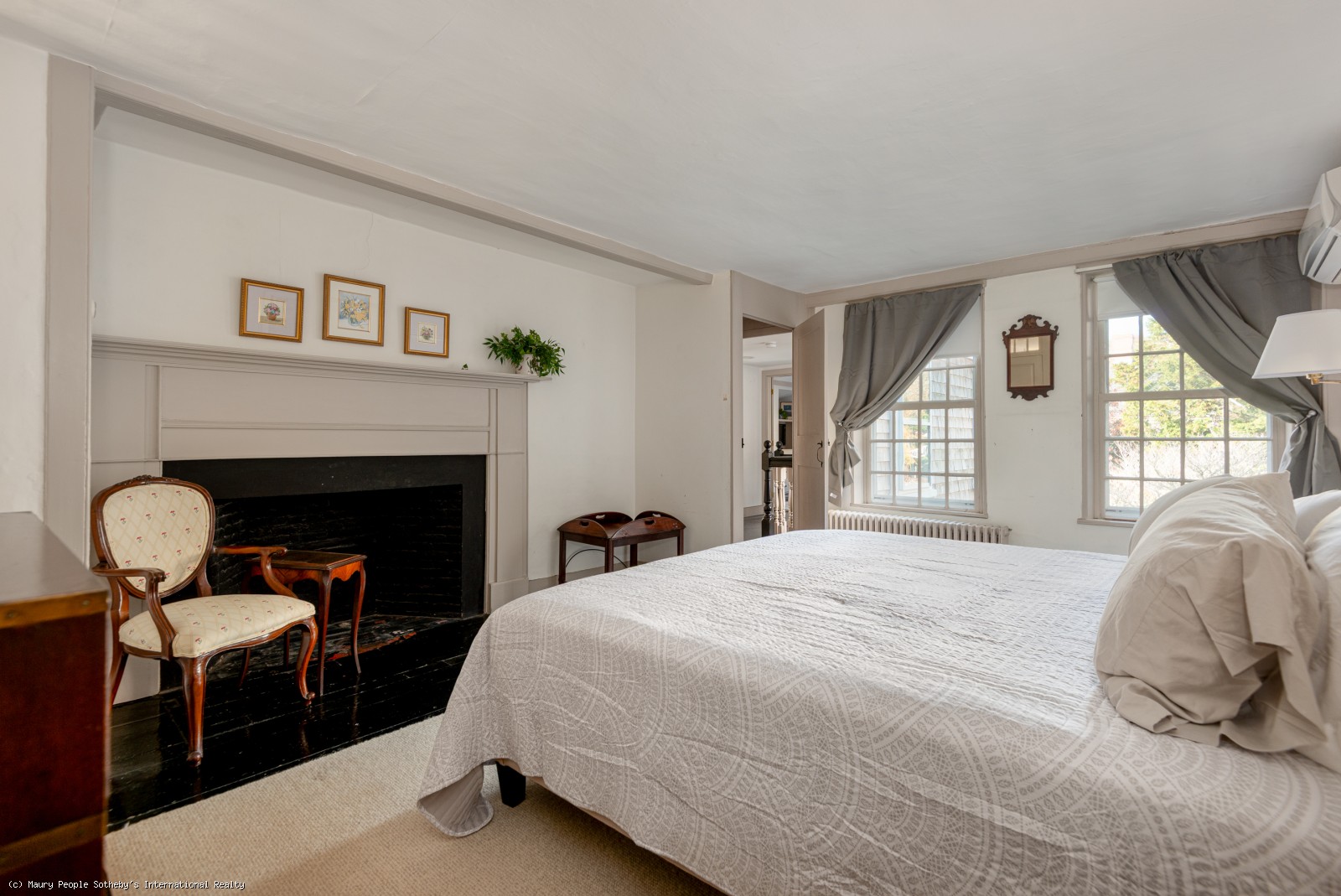 Bedroom with king bed and original pre-1800s fireplace