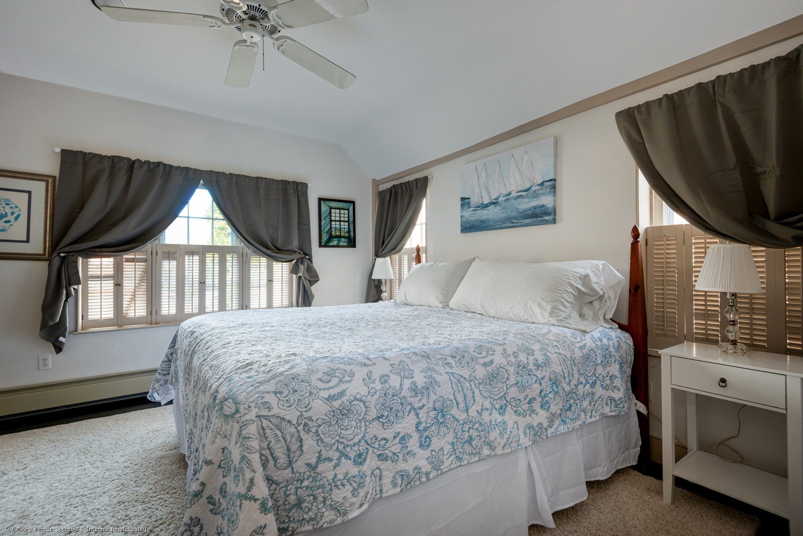 Primary bedroom with king bed and views of backyard gardens